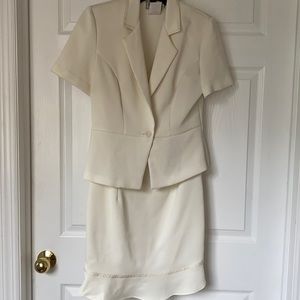 Sleeveless dress with short sleeve jacket.